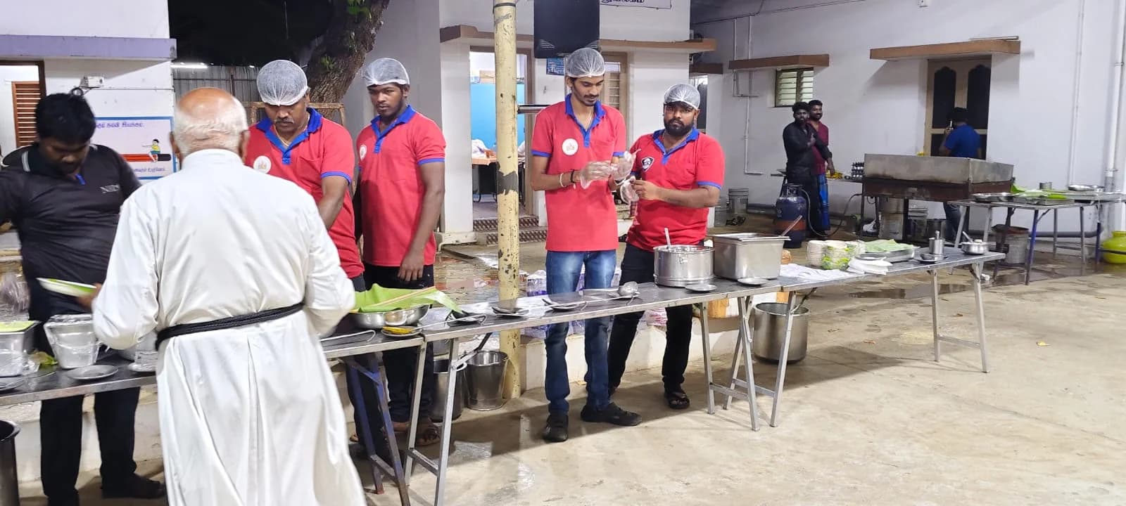 Non-veg buffet serving arrangement with biryani and curry dishes at event